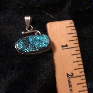 Brilliant blue stone set in real silver pendant